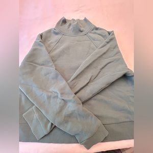 A new day, dark green turtle neck sweater.